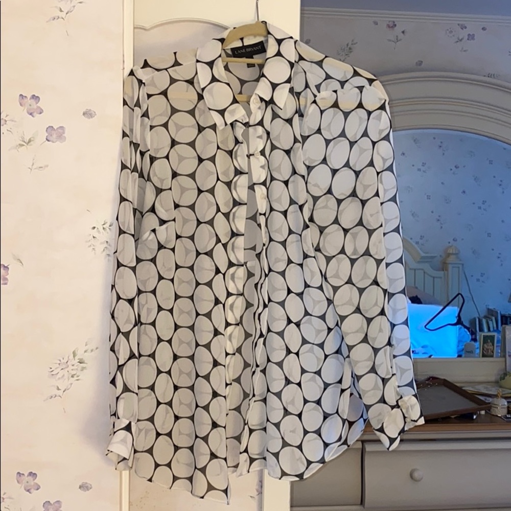 Sheer button down over blouse.